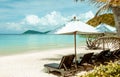 Landscape view ocean beautiful with umbrella, lounge on the beach and palm or coconut tree chairs at Island of sea Thailand. Royalty Free Stock Photo