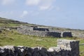 Landscape view of an old ring fort on the rocky burren limestone terrain of Inishmore, in western Ireland