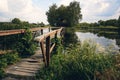 Landscape view of Old small wooden bridge across the lake. Fishman house on an island surrounded by wather and forest Royalty Free Stock Photo