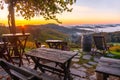 Landscape view over winery terrace, colorful sunrise and misty hills of Ratsch an der Weinstrasse, Austria, 2019.