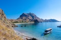 Landscape view from Padar Island, Komodo National Park, Indonesia. A tourist boat at the coast of Padar Island Royalty Free Stock Photo