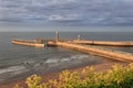 Landscape view of the pier and lighthouse in Whitby