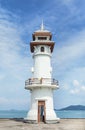 Ublic white lighthouse on pier of Bang Bao fishing village at Koh Chang Island,Trat, Thailand