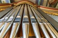 Landscape view of a rank of shiny steel pipes of a refurbished church organ Royalty Free Stock Photo