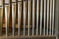 Landscape view of a rank of shiny steel pipes of a refurbished church organ Royalty Free Stock Photo