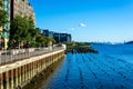 Landscape view of redeveloped Yonkers waterfront. Lined with restaurants, luxury apartments and public