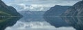 Landscape view of the rocky mountains reflected in water in Ardalsfjorden, Sognefjord area, Norway Royalty Free Stock Photo