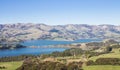 Rolling hills and harbour of Akaroa, Banks Peninsular, New Zealand. Royalty Free Stock Photo