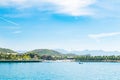 Landscape, view from the sea, white beach, palm trees, mountains, boat, plane in the sky, Vietnam. five star hotel. Royalty Free Stock Photo