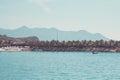 Landscape, view from the sea, white beach, palm trees, mountains, boat, plane in the sky, Vietnam. five star hotel Royalty Free Stock Photo