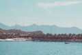 Landscape, view from the sea, white beach, palm trees, mountains, boat, plane in the sky, Vietnam. five star hotel Royalty Free Stock Photo