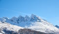 Landscape view of snow mountains and glacier ice after a heavy, arctic, winter snowstorm in Norway. Blue sky, copy space Royalty Free Stock Photo