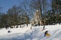 Children sledging and having fun in snow, Park Maksimir in Zagreb Royalty Free Stock Photo