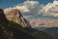 Landscape view with sunny Dolomites cloudy sky background