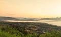 Landscape view of sunrise on high angle view with white fog in early morning over rainforest mountain Royalty Free Stock Photo