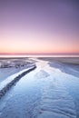 Landscape view of a sunset in a pink sky on the beach and West Coast of Jutland, Denmark. A beautiful sunrise on the Royalty Free Stock Photo