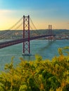Landscape view on the 25th of April Bridge during the sunset in Lisbon city, Portugal Royalty Free Stock Photo