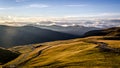 Landscape view of the Transalpina road in Romania with hills and mountains in the back at sunset Royalty Free Stock Photo