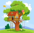 Landscape view of a treehouse in a park and an empty playground for children Royalty Free Stock Photo