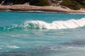 Landscape view of waves breaking over smooth granie rocks at Blue Haven Beach near Esperance in Western Australia under a bright Royalty Free Stock Photo