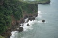 Landscape views of cliffs and waves crashing into the reef. Very dangerous place