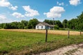 Landscape with a village house on a summer sunny day. Small white house Royalty Free Stock Photo