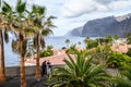 Landscape of the volcanic coast with red tile roofs of villas, Atlantic ocean. Selective focus. Los Gigantes, Tenerife