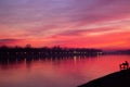 Landscape wallpaper; Sunset over river, beautiful pink sunset, reflection in the water Royalty Free Stock Photo