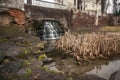 Landscape of waterfall flowing under old bridge Royalty Free Stock Photo