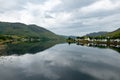 Landscape with waters of Loch Duich with a town of Dornie, Scotland in Scottish overcast weather