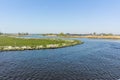 Landscape with waterways and canals of North Holland with boats, canal-side lifestyle in the Netherlands