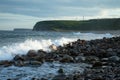 Landscape Waves crashing on coastal rocks at sunset Royalty Free Stock Photo