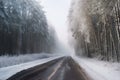 landscape weather seasonal temperature cold highway empty winter street frosty slippery forest covered snow Road Royalty Free Stock Photo