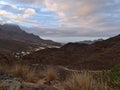 Landscape of the western coast of island Gran Canaria, Spain with remote village La Aldea de San Nicolas surrounded by mountains. Royalty Free Stock Photo