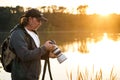 Landscape and wildlife photographer looks at photos on camera screen Royalty Free Stock Photo