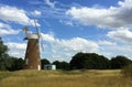 Landscape with windmill in a wheat field in Britain Royalty Free Stock Photo