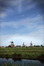 Landscape. Windmills stand on the banks of the river