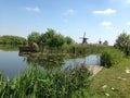 Traditional windmills, Kinderdijk, Holland with cradle in front of it Royalty Free Stock Photo