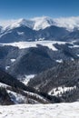 Landscape of winter mountains with a lot of snow at sunny day. Picturesque and gorgeous wintry scene. Royalty Free Stock Photo