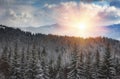 Landscape of winter mountains at sunshine. View of the snowfall and snow covered hills. Royalty Free Stock Photo