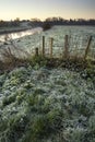 Landscape Winter surnise of river and frosty fields