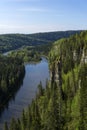 Wooded river valley with rocks