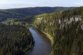 Wooded river valley with rocks