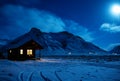 Landscape with a wooden house with light from the window in a winter night. Scenic view of moonlight on the snow with mountains i