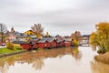 Landscape with wooden houses along the river