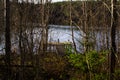 Landscape, wooden pier on the lake, autumn view of the forest by the lake, reflection of trees on the water Royalty Free Stock Photo