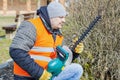 Landscape worker check bush cutter