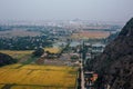 Landscape yellow fields and cities. View from the mountain. Asia Royalty Free Stock Photo