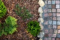 landscaped garden - mulched flower bed and granite cobblestone path Royalty Free Stock Photo