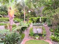 Landscaped garden of various plants, trees, and bushes and steps